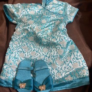 American girl Chinese blue satin dress and shoes.